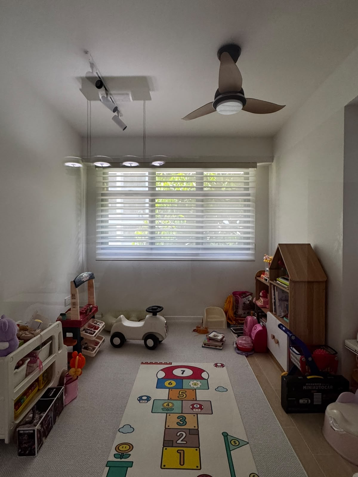 Day-night blind filtering light in a family room