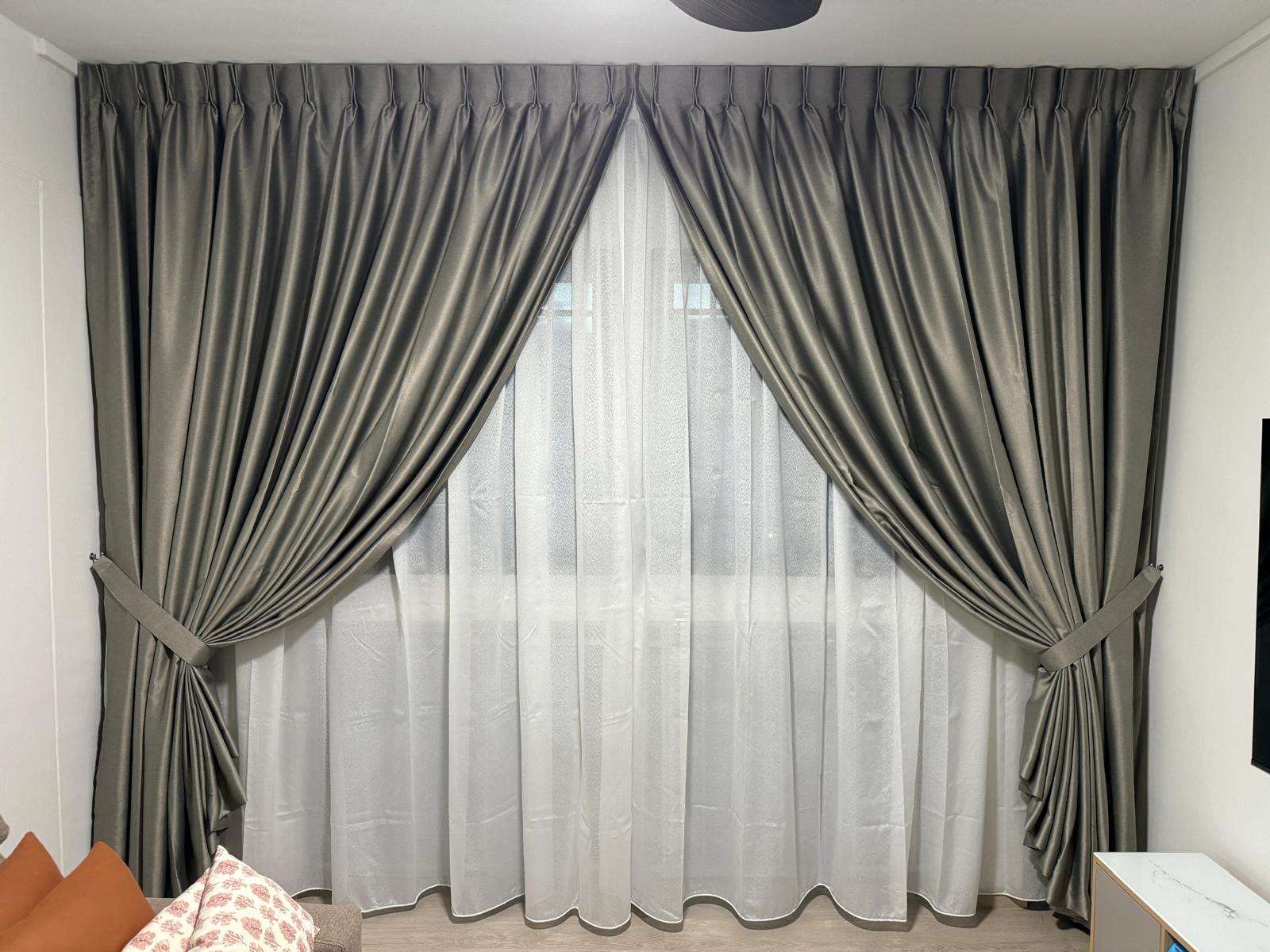 Brown day-and-night blinds fitted across a corner window