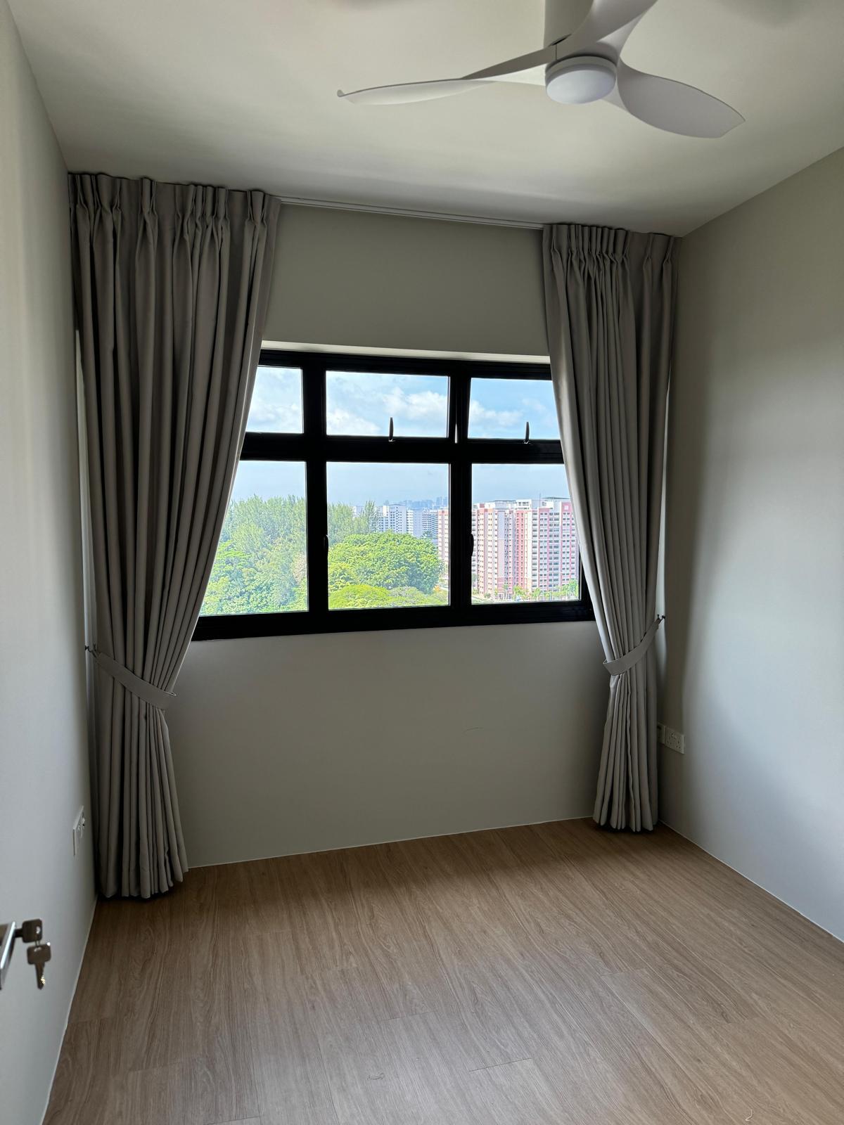 Dark day-and-night blind installed over a window