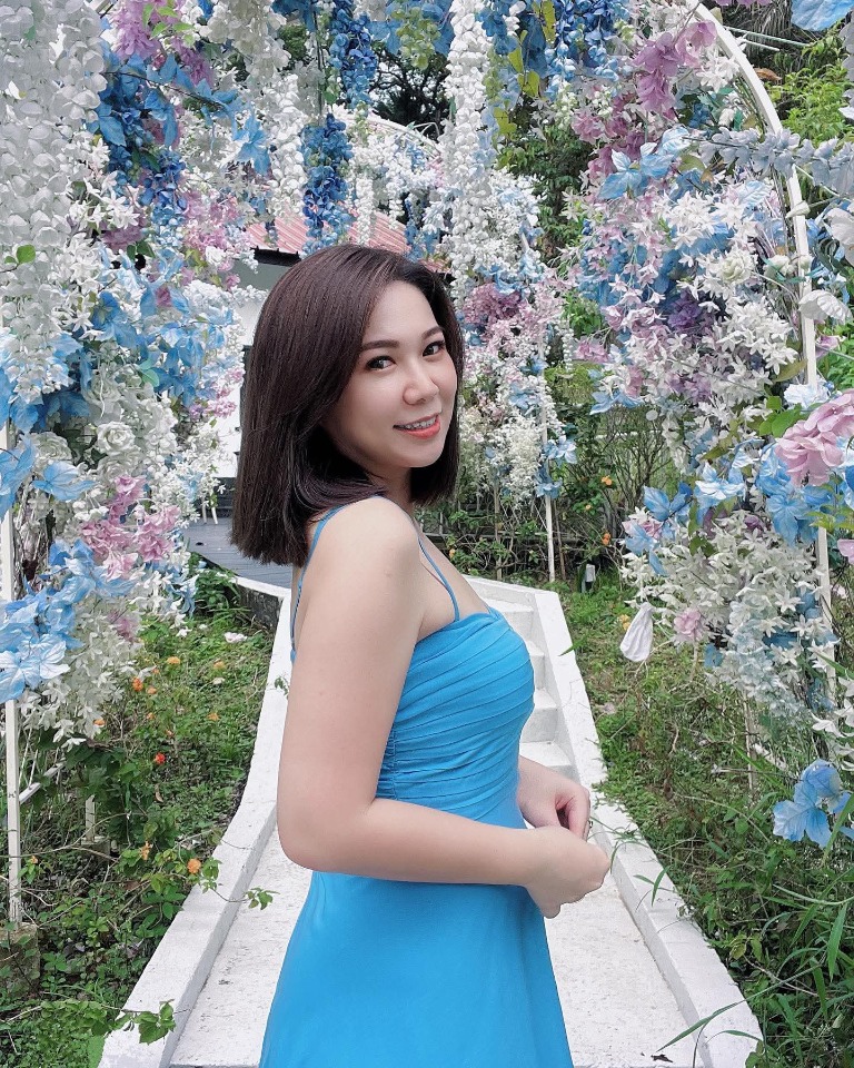 Sharon Curtains ambassador portrait in a blue dress