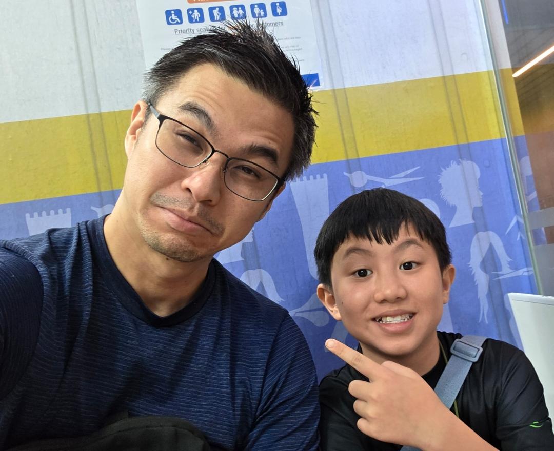A father and child taking a selfie